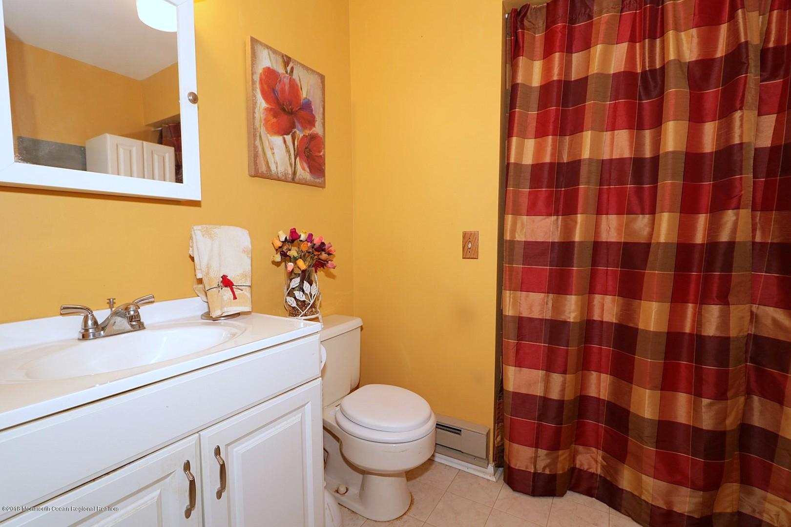 34 B Mill Road Whiting, NJ 08759 - Photo 17 of 22 a bathroom with a sink toilet and shower