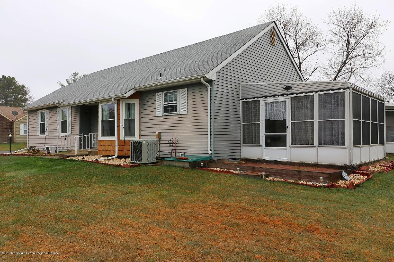 34 B Mill Road Whiting, NJ 08759 - Photo 2 of 22 a front view of a house with a garden