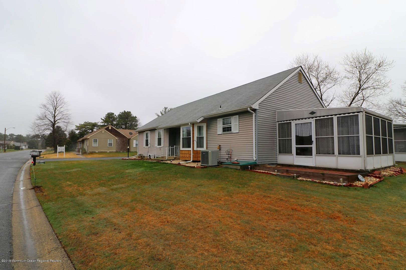 34 B Mill Road Whiting, NJ 08759 - Photo 22 of 22 a view of a house with a yard and sitting area