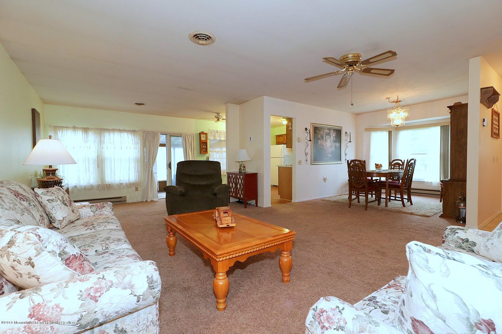 34 B Mill Road Whiting, NJ 08759 - Photo 3 of 22 a living room with furniture and kitchen view