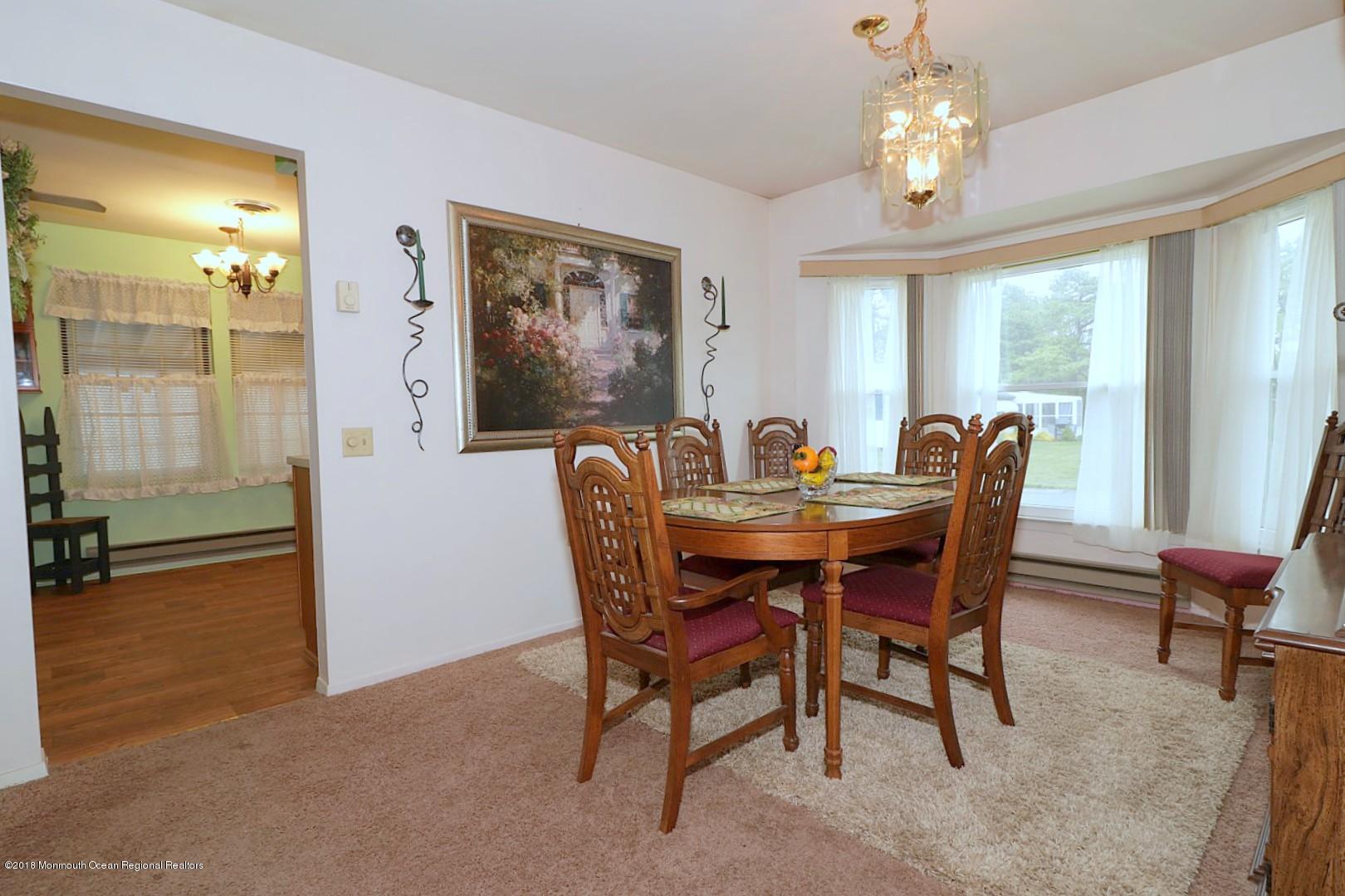 34 B Mill Road Whiting, NJ 08759 - Photo 4 of 22 a view of a dining room with furniture window and outside view