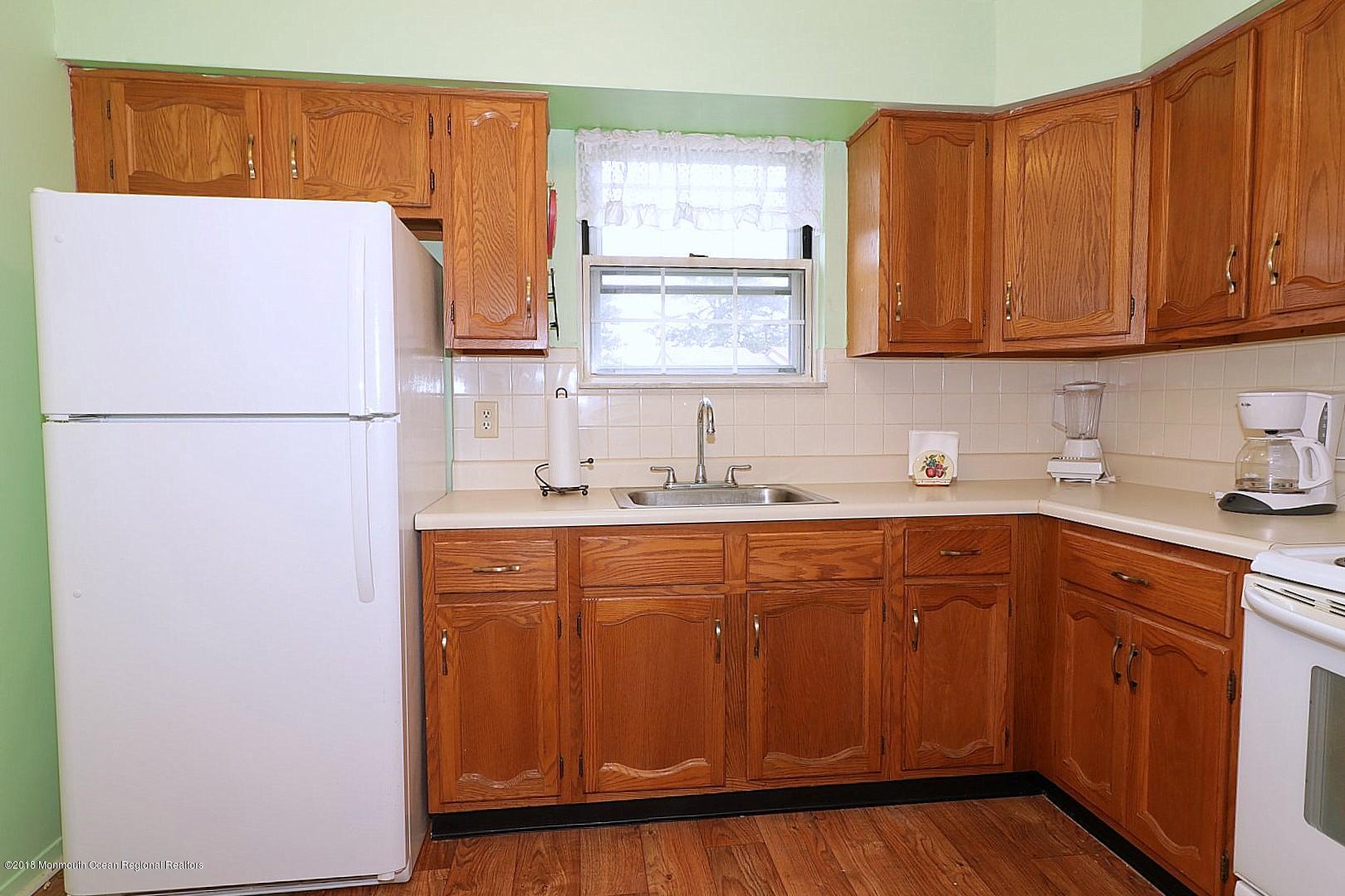 34 B Mill Road Whiting, NJ 08759 - Photo 8 of 22 a kitchen with stainless steel appliances granite countertop a refrigerator sink and cabinets