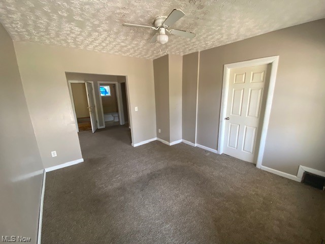 921 Rudyard Road Cleveland, OH 44110 - Photo 16 of 31 Carpeted empty room with a textured ceiling and ceiling fan