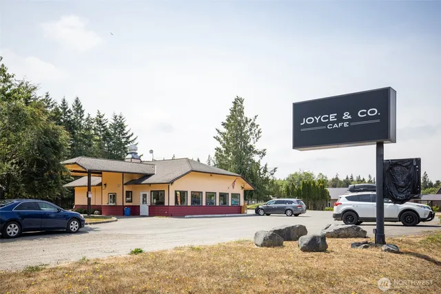 a view of a house with large windows and a table