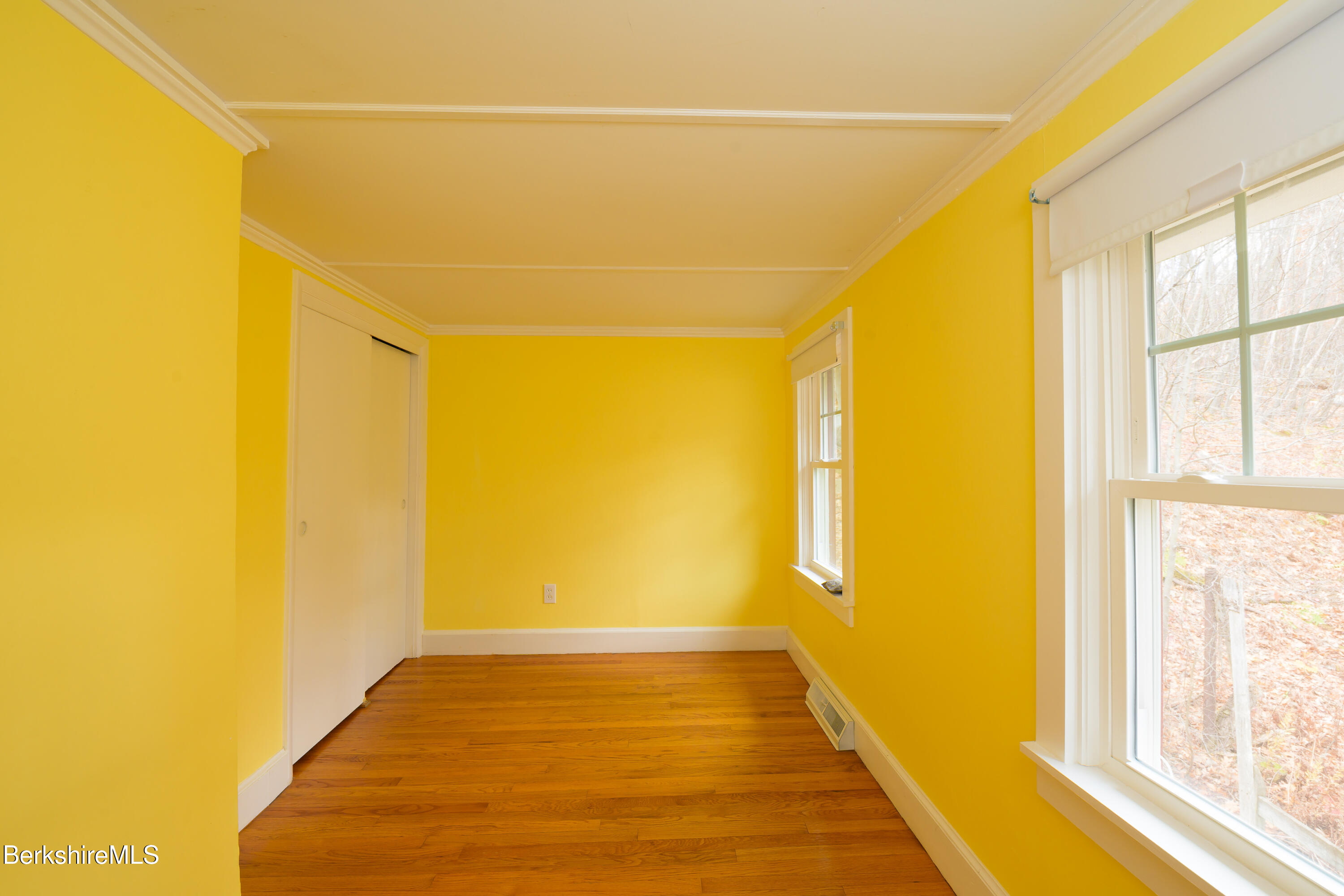 363 Henderson Road Williamstown, MA 01267 - Photo 19 of 24 a view of a big room with wooden floor and windows