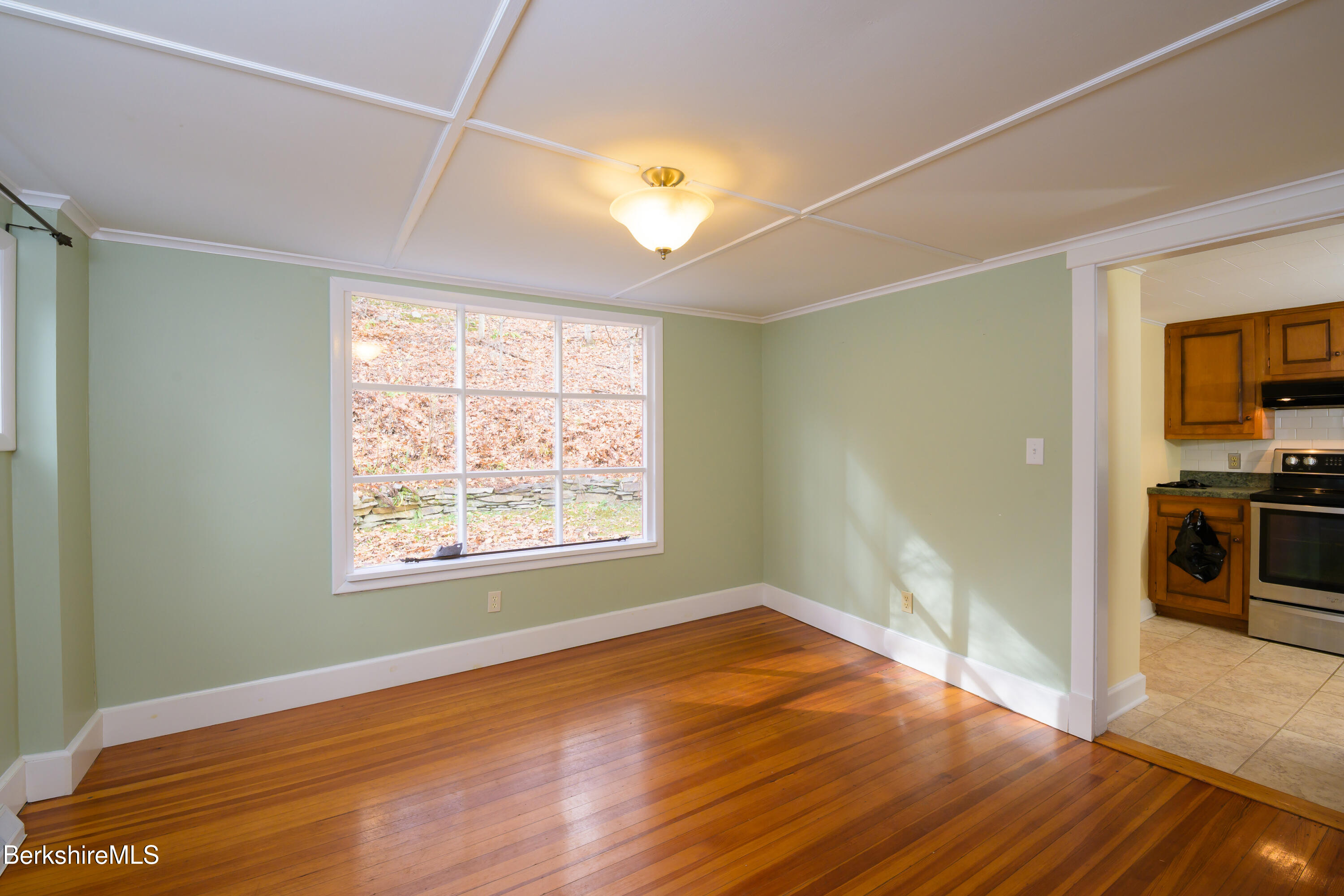 363 Henderson Road Williamstown, MA 01267 - Photo 9 of 24 a view of empty room with wooden floor and fan
