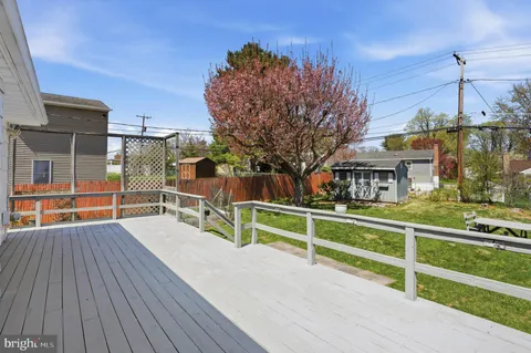 a view of a house with wooden deck