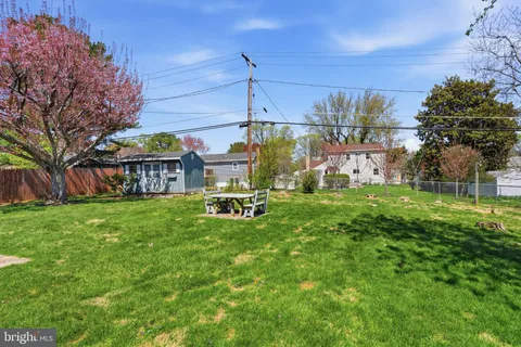a view of a house with a yard porch and sitting area