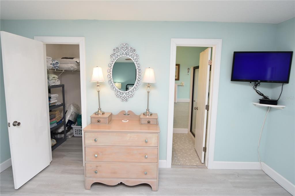 59 Fallen Oak Lane Palm Coast, FL 32137 - Photo 20 of 35 a room with a mirror and dresser