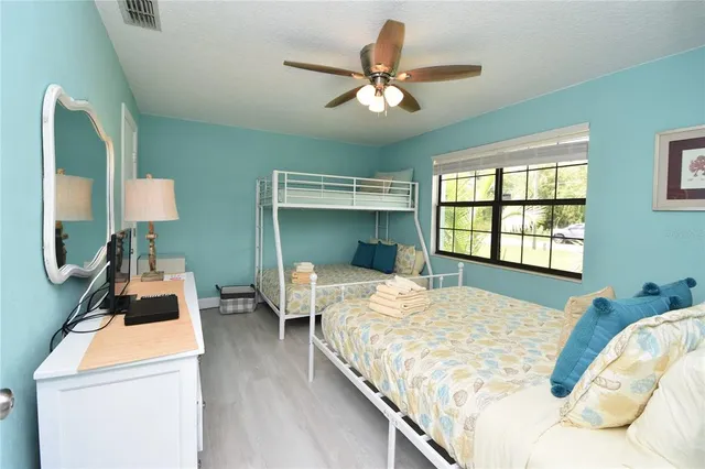 a bed room with a bed and a window