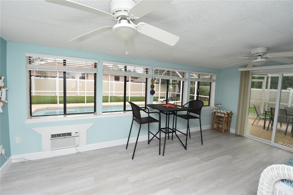 59 Fallen Oak Lane Palm Coast, FL 32137 - Photo 29 of 35 a view of a dining room with furniture window and wooden floor