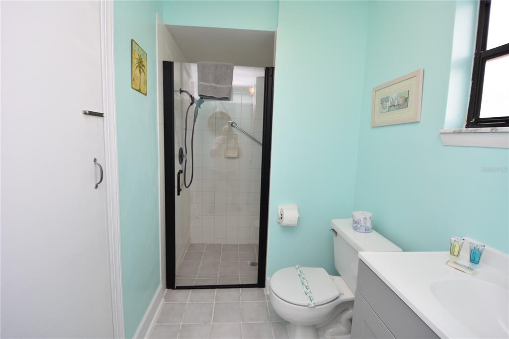 59 Fallen Oak Lane Palm Coast, FL 32137 - Photo 33 of 35 a white toilet sitting next to a bathroom sink