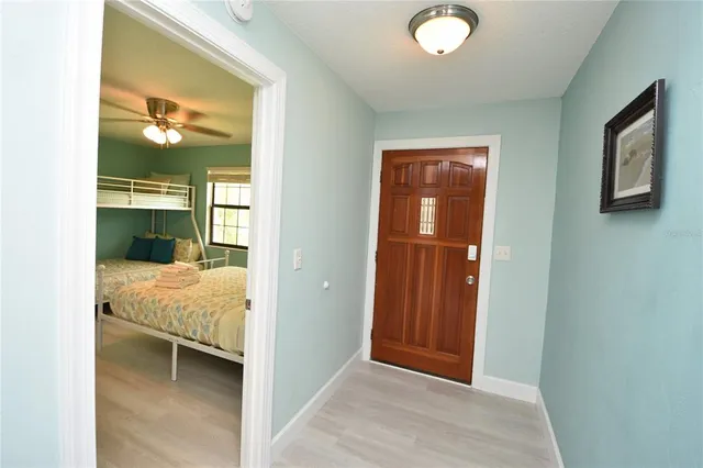 a view of a bedroom with bed and bathroom