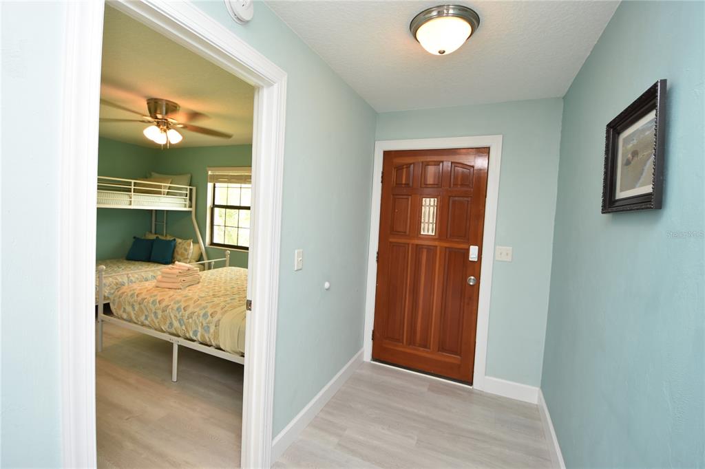 59 Fallen Oak Lane Palm Coast, FL 32137 - Photo 6 of 35 a view of a bedroom with bed and bathroom