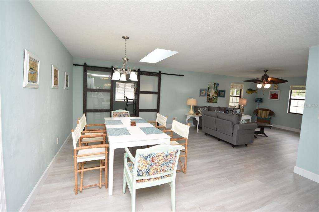 59 Fallen Oak Lane Palm Coast, FL 32137 - Photo 7 of 35 a view of a dining room with furniture and chandelier