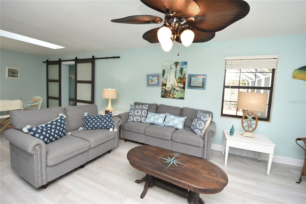 59 Fallen Oak Lane Palm Coast, FL 32137 - Photo 10 of 35 a living room with furniture ceiling fan and a window