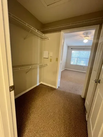 a kitchen with a sink and wooden floor