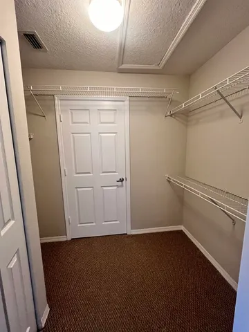 a bathroom with a double vanity sink toilet and shower