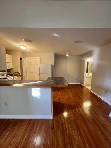 a view of a livingroom with wooden floor