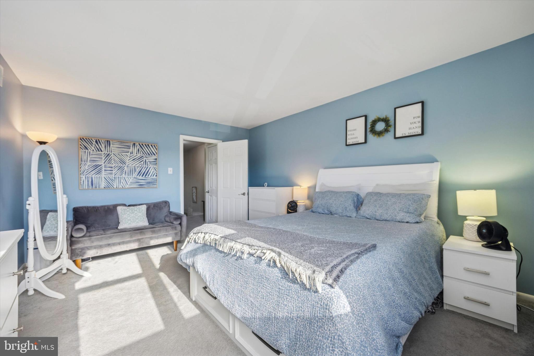 7011 Matthias Street Philadelphia, PA 19128 - Photo 12 of 28 a bedroom with a large bed and a couch