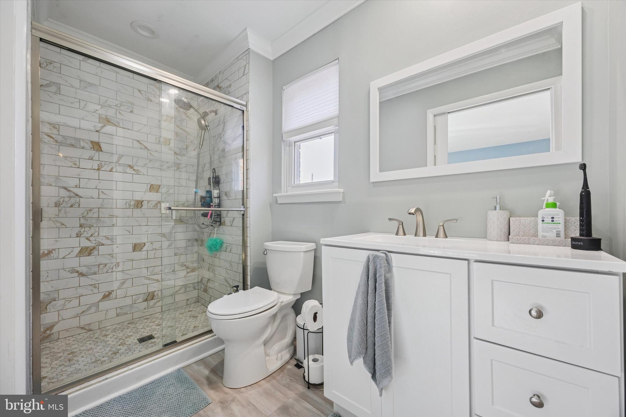 7011 Matthias Street Philadelphia, PA 19128 - Photo 13 of 28 a bathroom with a sink a toilet and shower