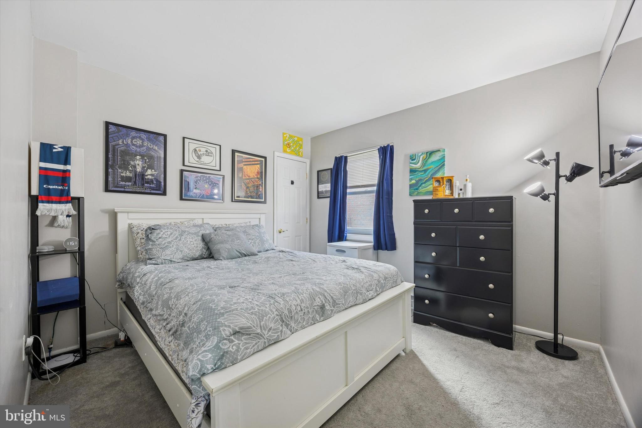 7011 Matthias Street Philadelphia, PA 19128 - Photo 17 of 28 a bedroom with a bed and a dresser