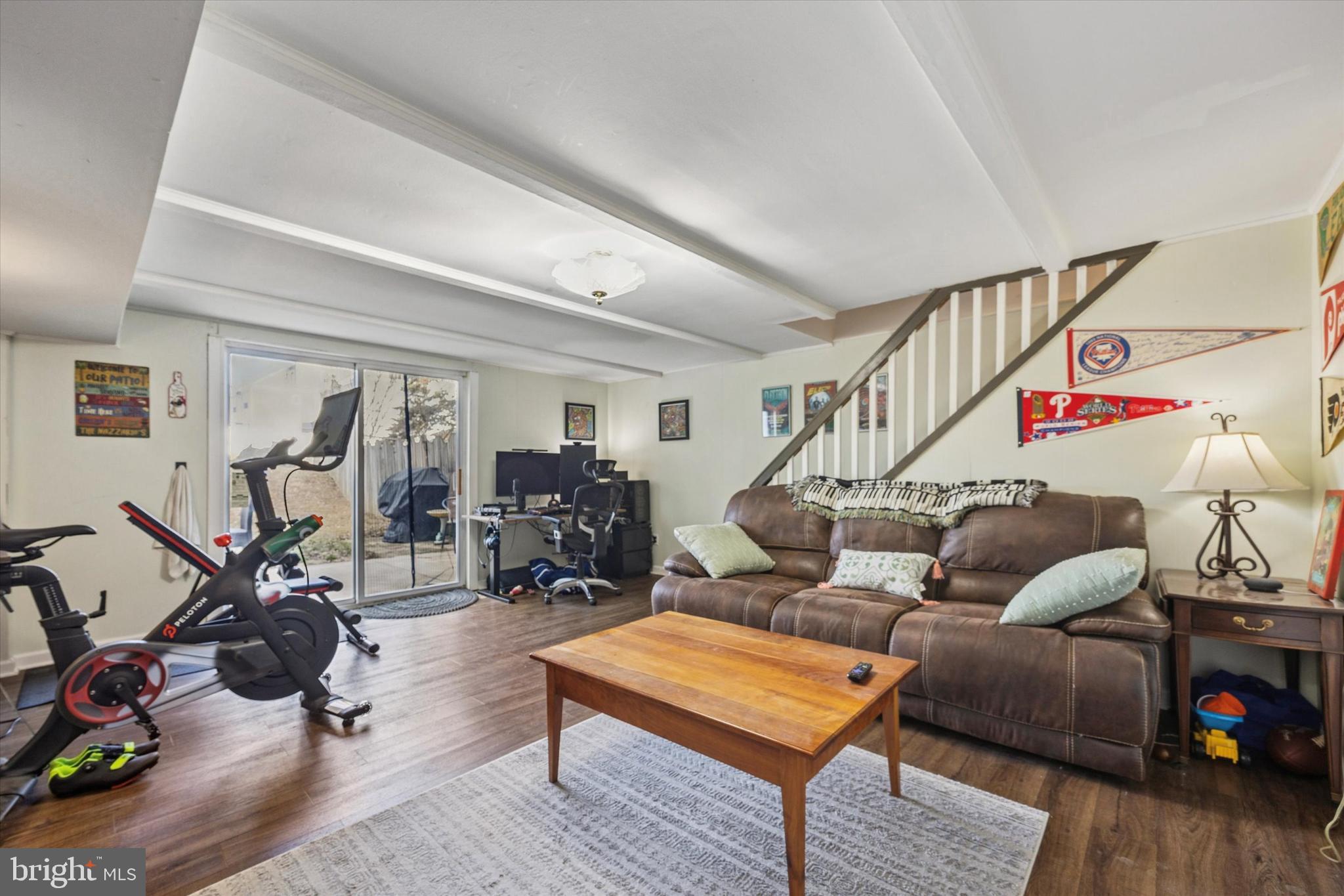 7011 Matthias Street Philadelphia, PA 19128 - Photo 21 of 28 a living room with furniture a rug and gym equipment