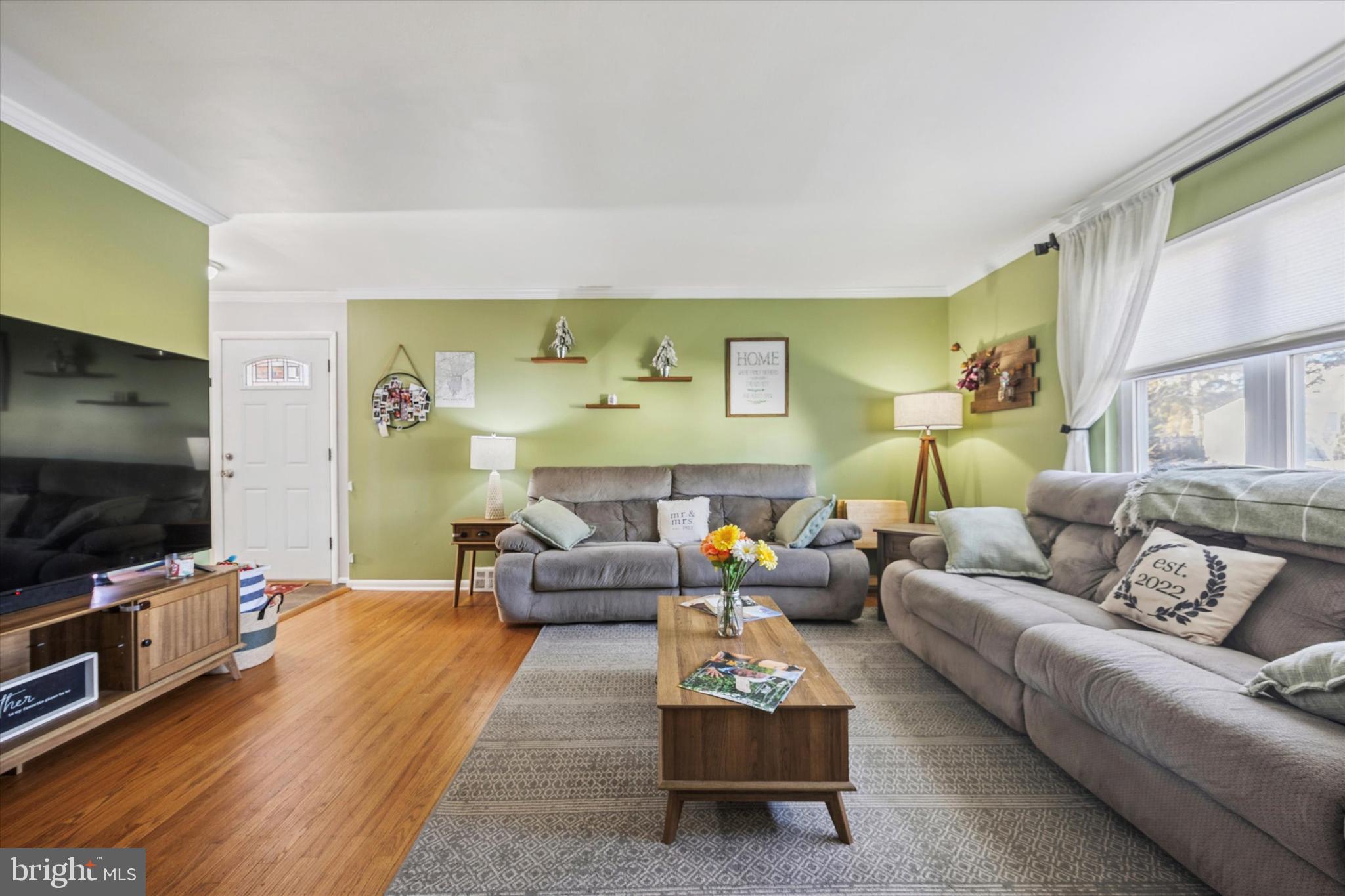 7011 Matthias Street Philadelphia, PA 19128 - Photo 4 of 28 a living room with furniture and a flat screen tv