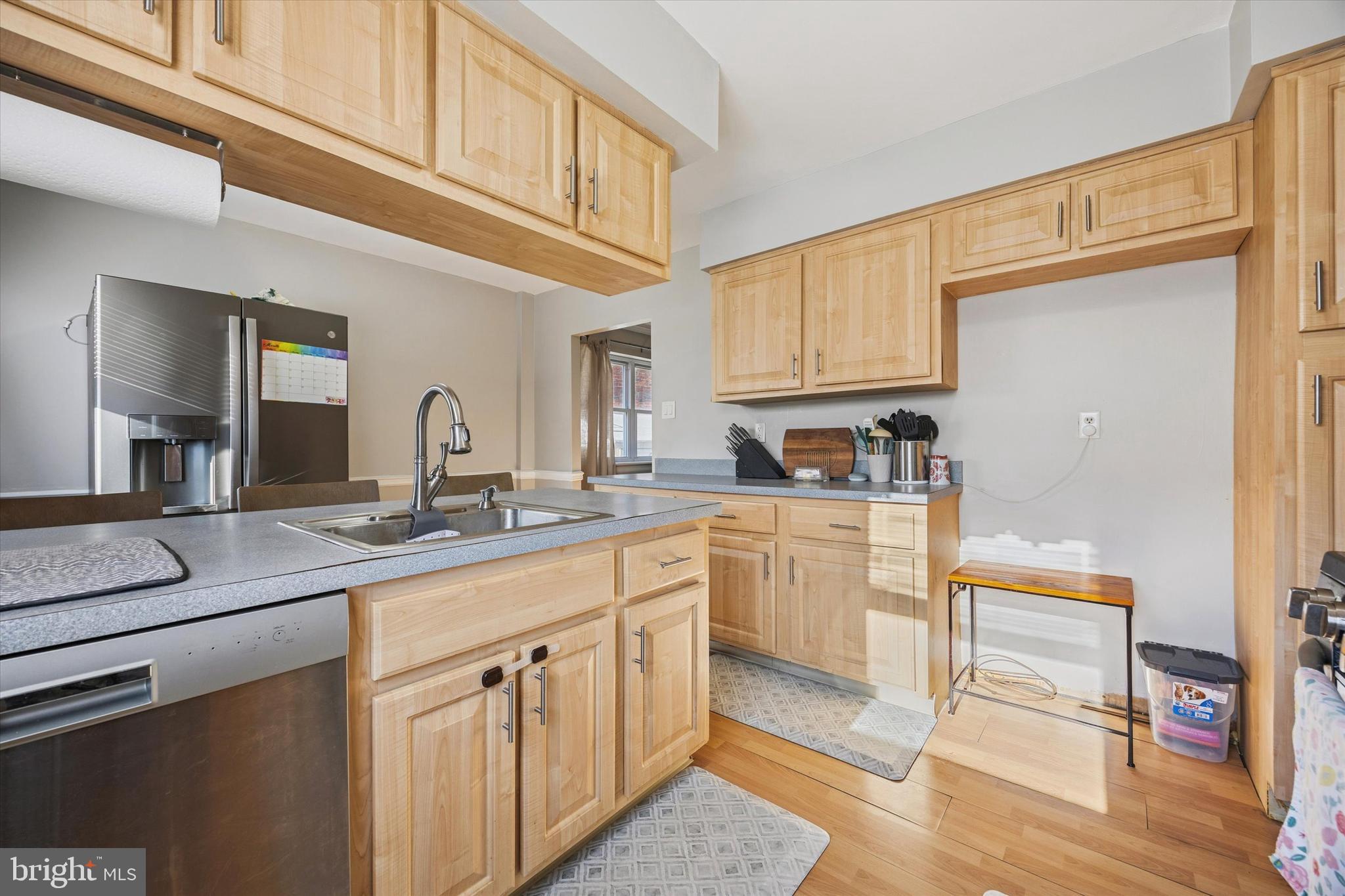 7011 Matthias Street Philadelphia, PA 19128 - Photo 9 of 28 a kitchen with cabinets appliances a sink and a counter top space