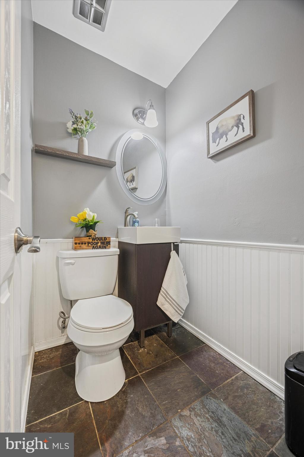 7011 Matthias Street Philadelphia, PA 19128 - Photo 10 of 28 a bathroom with a toilet a sink and a mirror