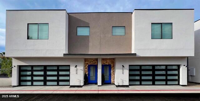 a front view of a house with garage