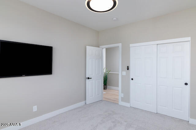 3832 East Monterey Way Phoenix, AZ 85018 - Photo 12 of 15 a view of a livingroom with wooden floor and a flat screen tv