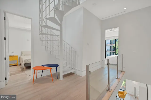 a large bedroom with a large bed and glass door
