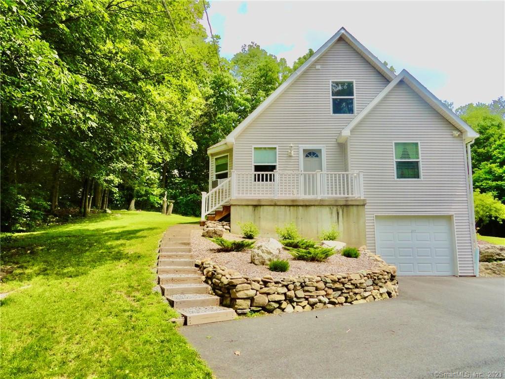 437 County Road Torrington, CT 06790 - Photo 1 of 1 a view of a house with a yard and garden