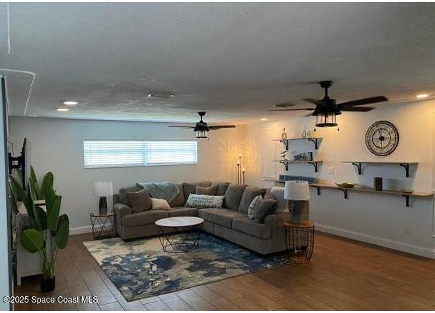 2130 South Patrick Drive Indian Harbour Beach, FL 32937 - Photo 3 of 14 a living room with furniture a rug and a window