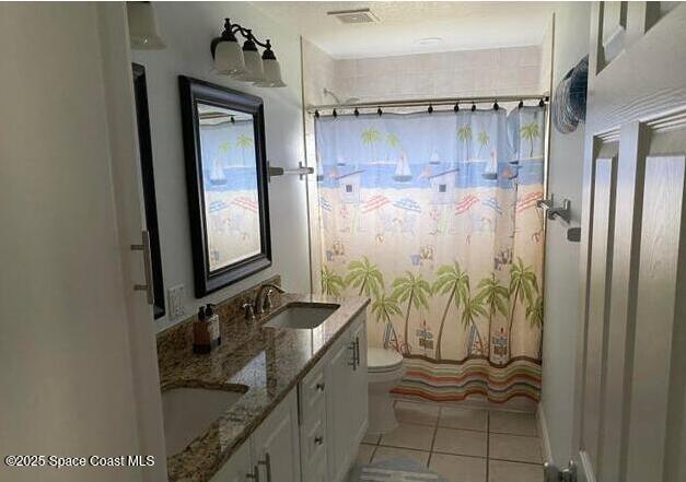 2130 South Patrick Drive Indian Harbour Beach, FL 32937 - Photo 7 of 14 a bathroom with a granite countertop sink a mirror and shower