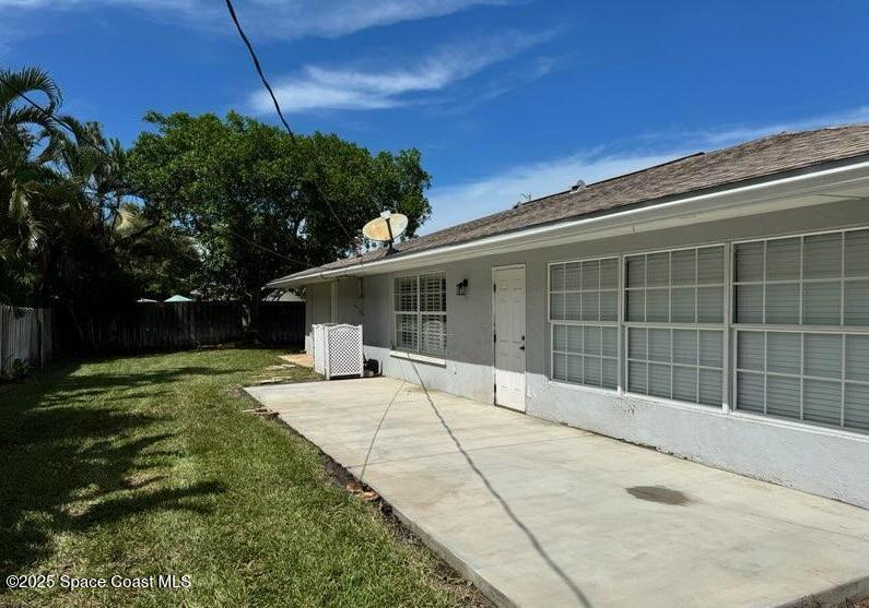 2130 South Patrick Drive Indian Harbour Beach, FL 32937 - Photo 9 of 14 a view of a house with a yard and potted plants