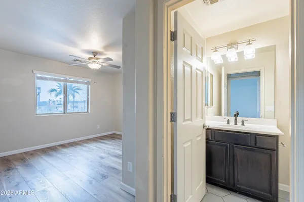 a bathroom with a sink toilet vanity and shower