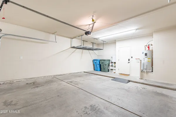 a bathroom with a granite countertop sink and a large mirror