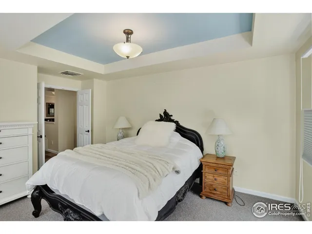 a kitchen with a sink cabinets and wooden floor