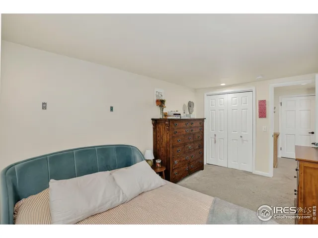 a bathroom with a granite countertop sink mirror vanity and toilet