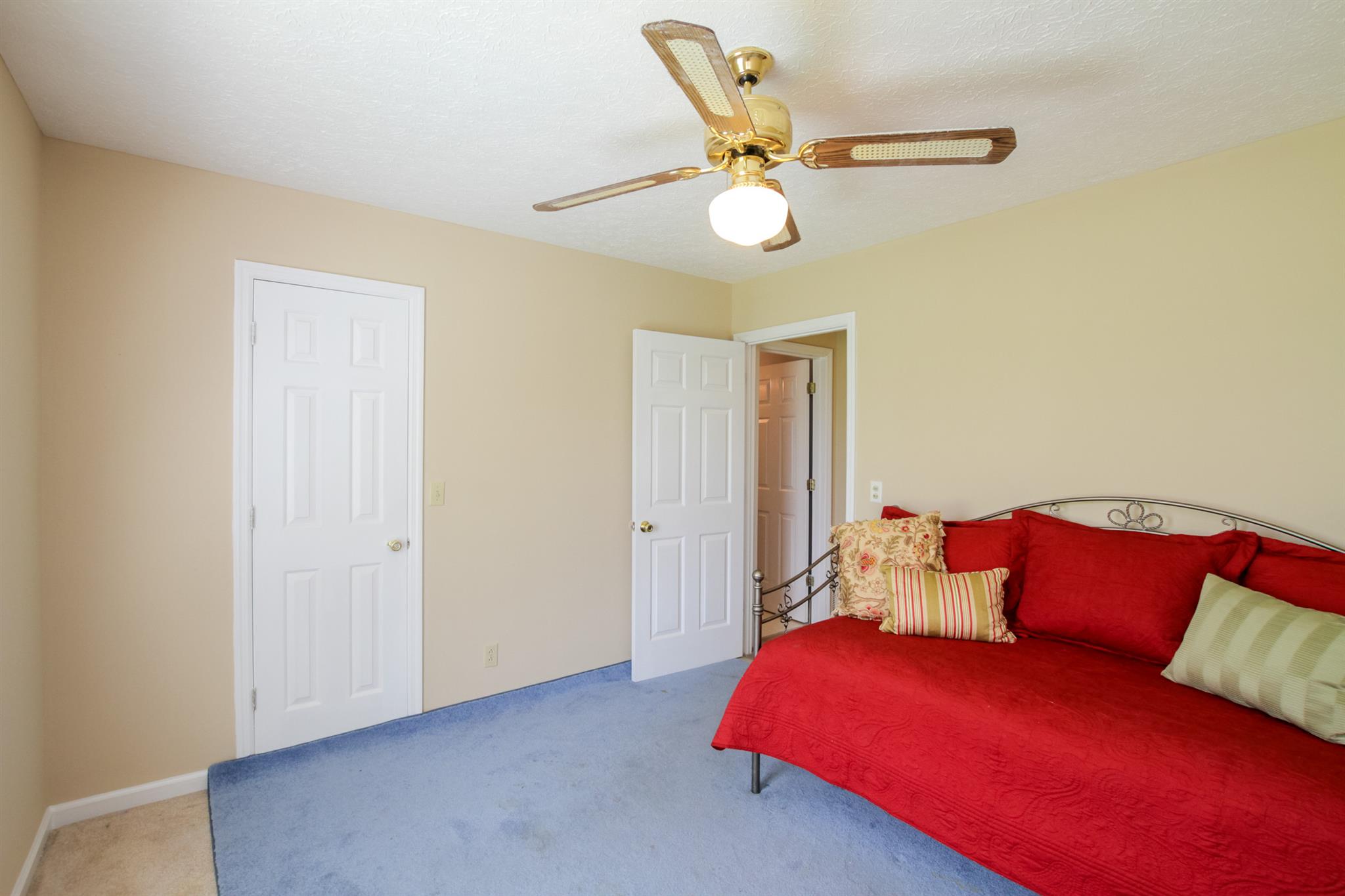 3902 Armstrong Road Springfield, TN 37172 - Photo 21 of 30 a bedroom with a bed and a chandelier