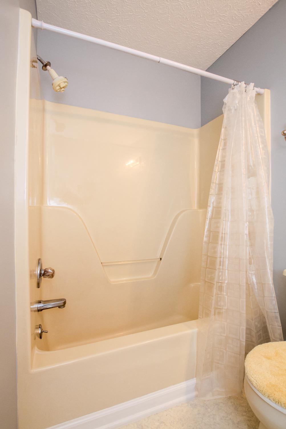 3902 Armstrong Road Springfield, TN 37172 - Photo 23 of 30 a bathroom with a bathtub and a shower