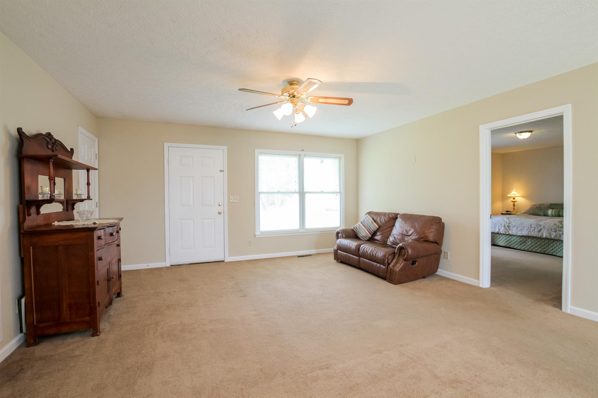 3902 Armstrong Road Springfield, TN 37172 - Photo 4 of 30 a living room with furniture and a chandelier