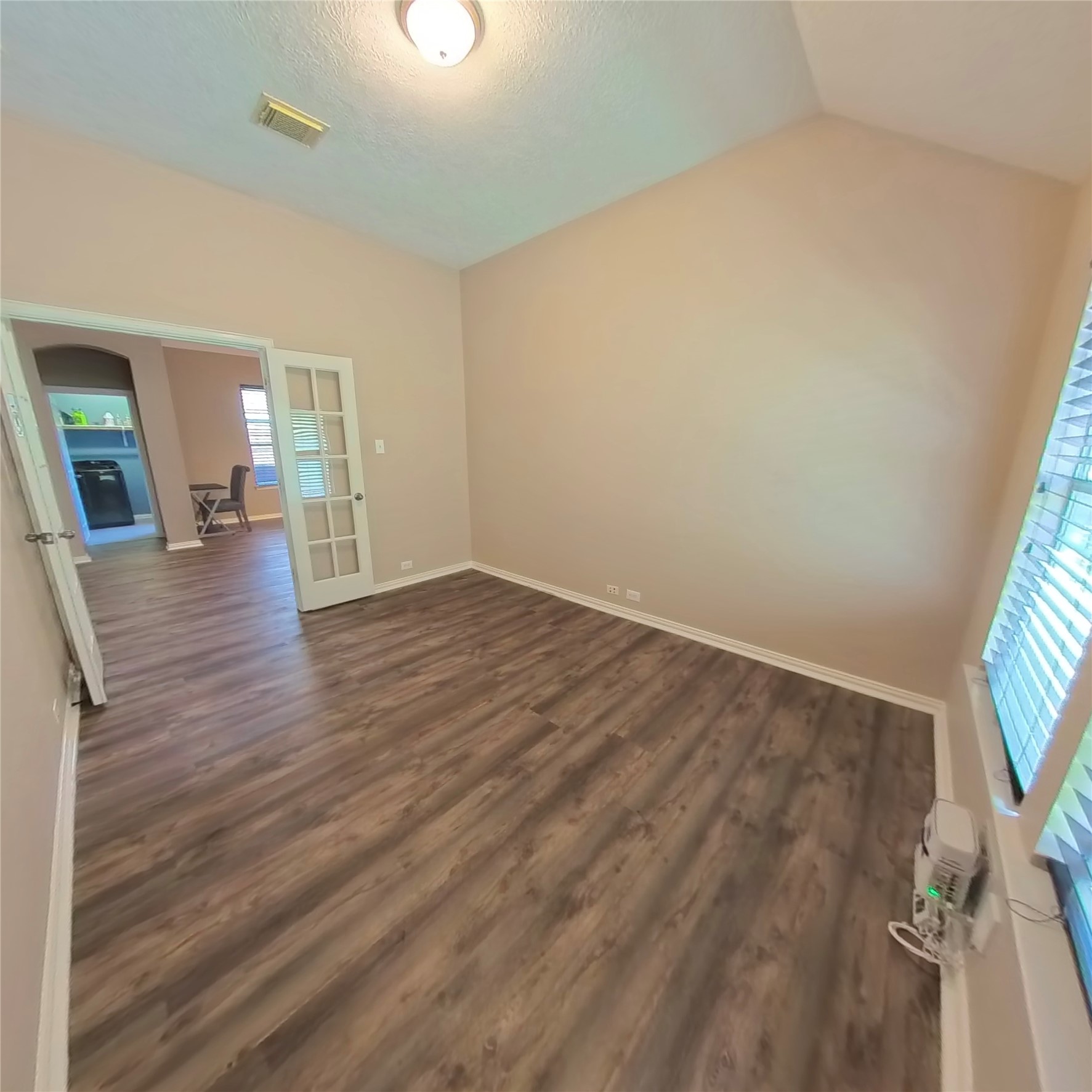 30938 Blue Ridge Park Lane Spring, TX 77386 - Photo 14 of 32 wooden floor in an empty room with a window