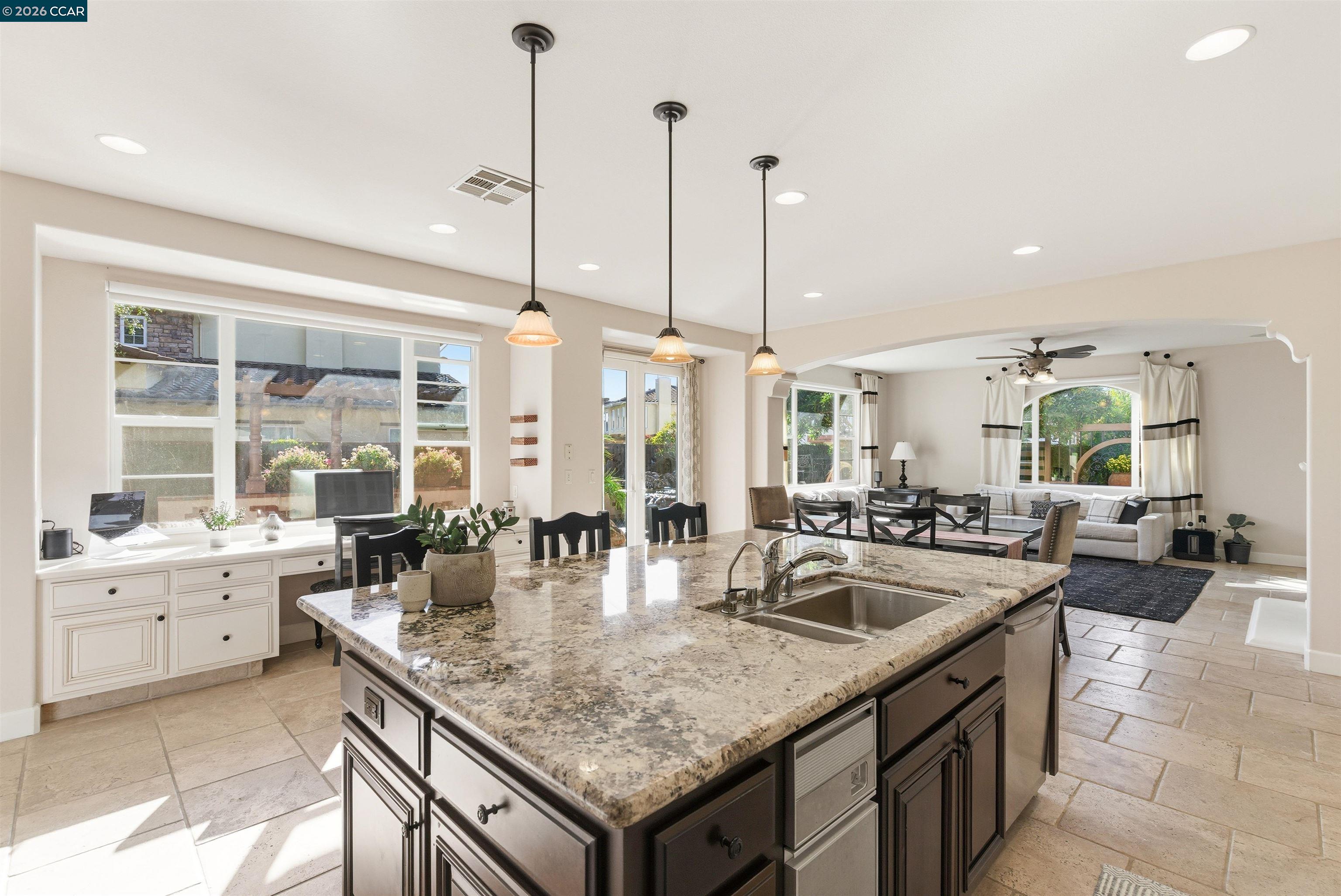 1041 South Wedgewood Road San Ramon, CA 94582 - Photo 13 of 33 a kitchen with granite countertop a sink and stove