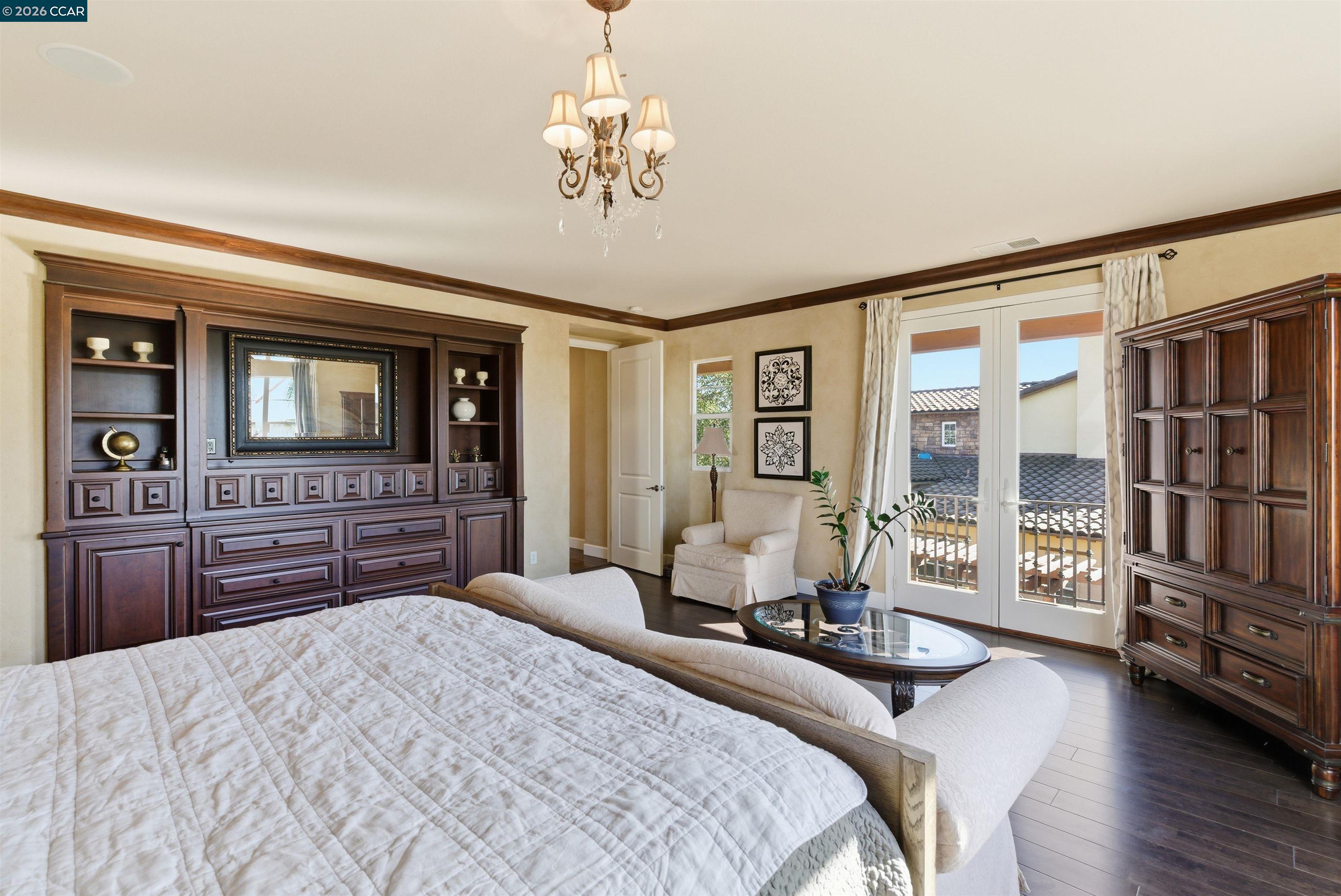 1041 South Wedgewood Road San Ramon, CA 94582 - Photo 19 of 33 a bedroom with a balcony a bed and dresser with wooden floor