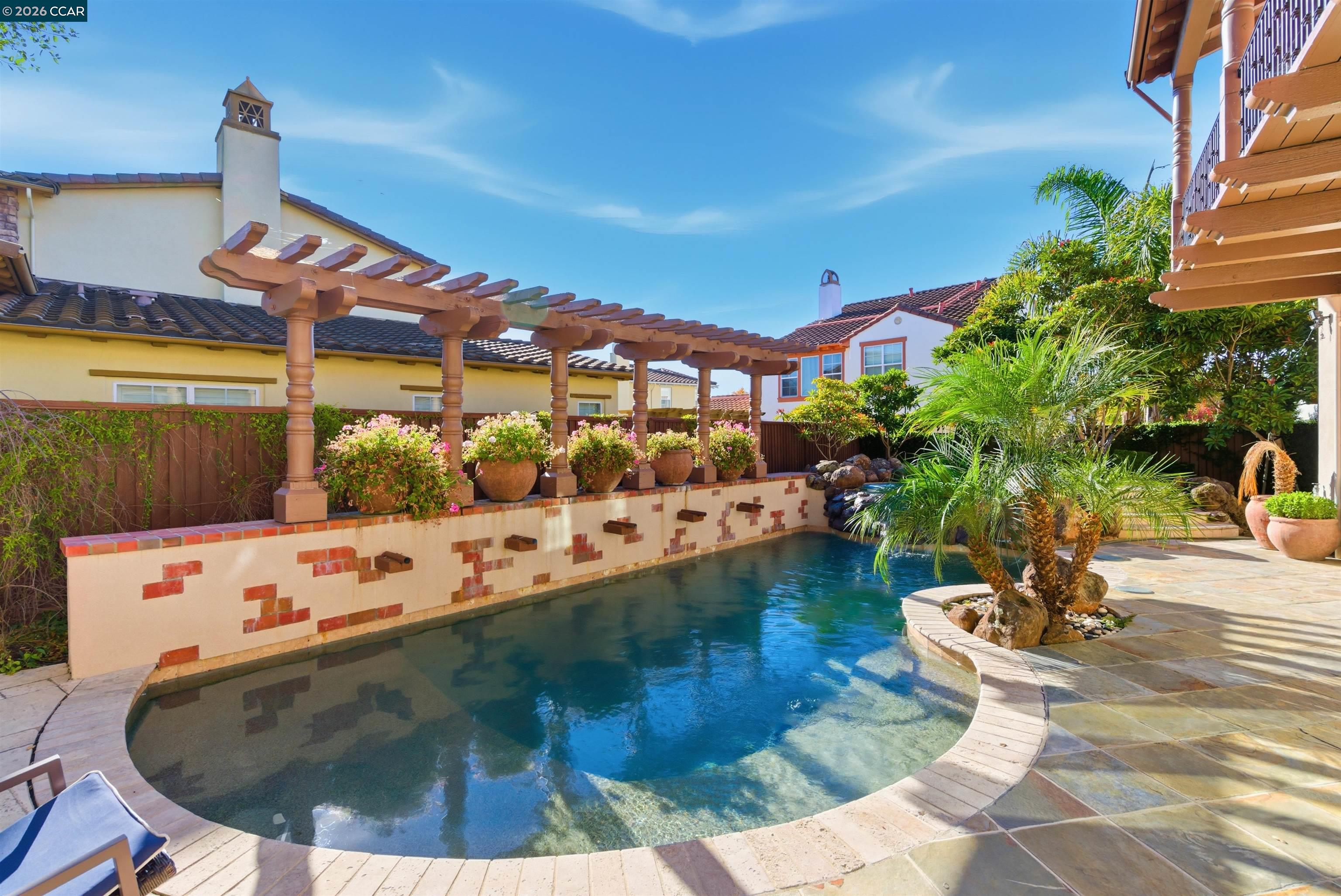 1041 South Wedgewood Road San Ramon, CA 94582 - Photo 4 of 33 a view of a swimming pool with outdoor seating