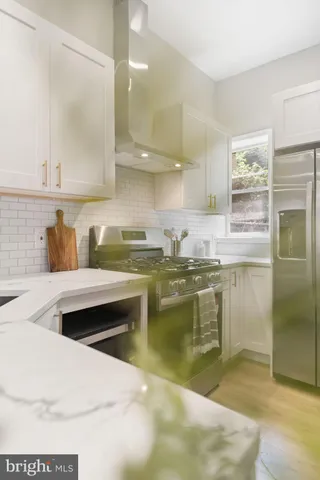 a kitchen with a sink cabinets and window