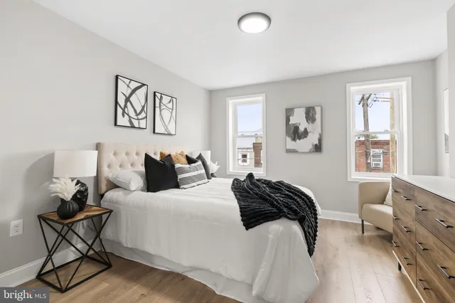 a bedroom with a bed and a mirror